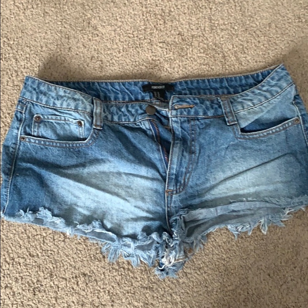 Very short frayed denim shorts